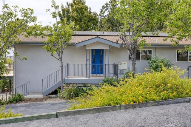 1770 Alrita St, San Luis Obispo, CA 93401 - view of front of house with stucco siding and roof mounted solar panels