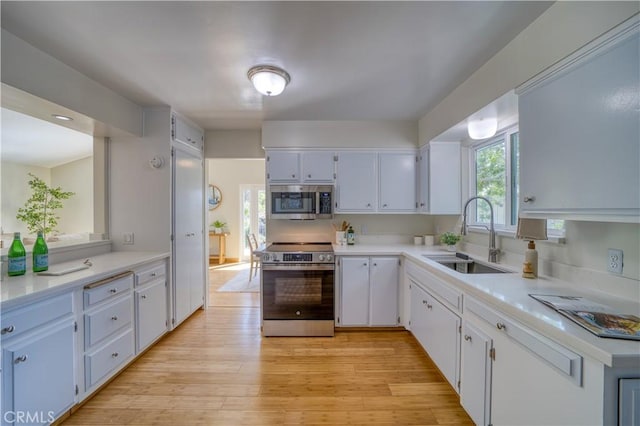 1770 Alrita St, San Luis Obispo, CA 93401 - kitchen featuring appliances with stainless steel finishes, white cabinets, and light countertops