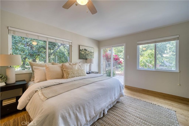 1770 Alrita St, San Luis Obispo, CA 93401 - bedroom featuring multiple windows, access to exterior, wood finished floors, and ceiling fan