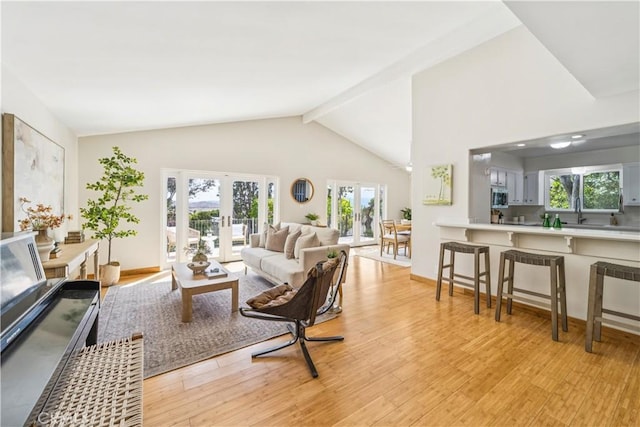 1770 Alrita St, San Luis Obispo, CA 93401 - living room featuring light wood-style flooring, beamed ceiling, french doors, and high vaulted ceiling
