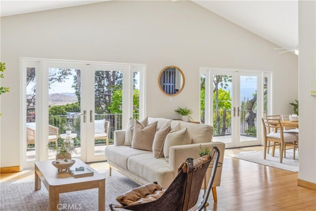 1770 Alrita St, San Luis Obispo, CA 93401 - living room with french doors, high vaulted ceiling, and light wood-style flooring