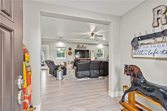678 Colusa, Gridley, CA 95948 - living room featuring ceiling fan, light wood-style flooring, baseboards, and crown molding