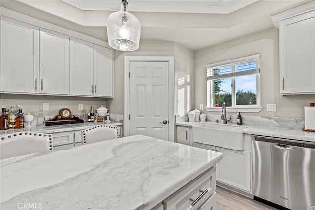 678 Colusa, Gridley, CA 95948 - kitchen with stainless steel dishwasher, a sink, light stone counters, white cabinetry, and ornamental molding