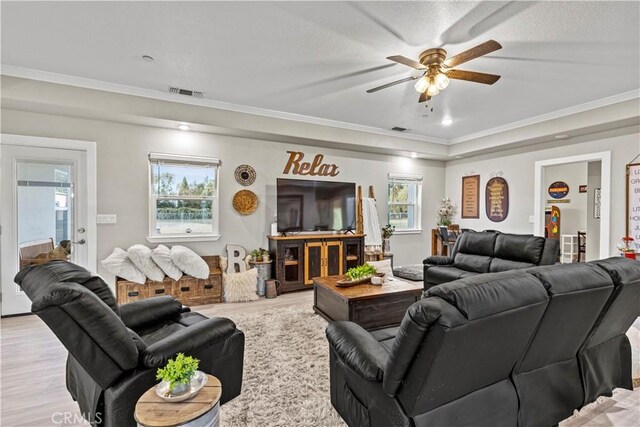 678 Colusa, Gridley, CA 95948 - living room featuring ornamental molding, a ceiling fan, wood finished floors, and healthy amount of natural light