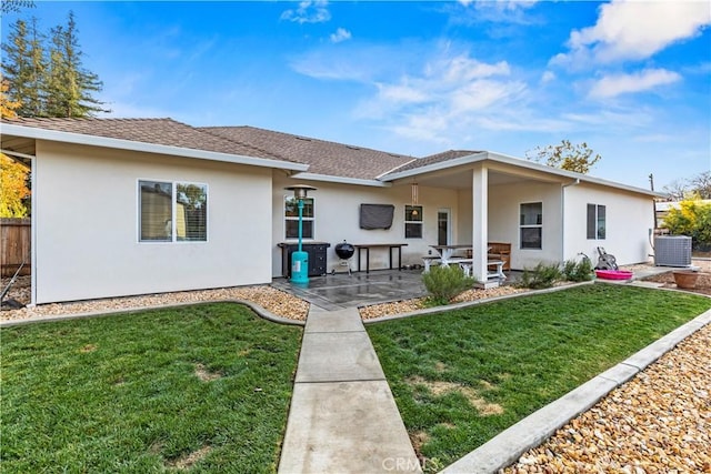 678 Colusa, Gridley, CA 95948 - rear view of house with stucco siding, a patio area, central AC, and roof with shingles