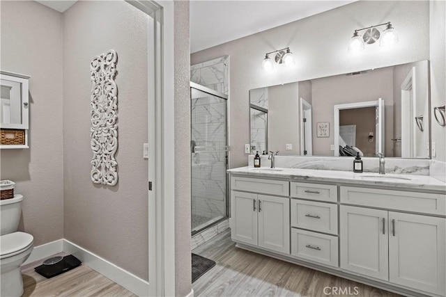 678 Colusa, Gridley, CA 95948 - full bath featuring toilet, wood finished floors, double vanity, and a stall shower