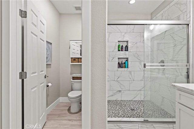 678 Colusa, Gridley, CA 95948 - full bath with toilet, a shower stall, vanity, baseboards, and recessed lighting