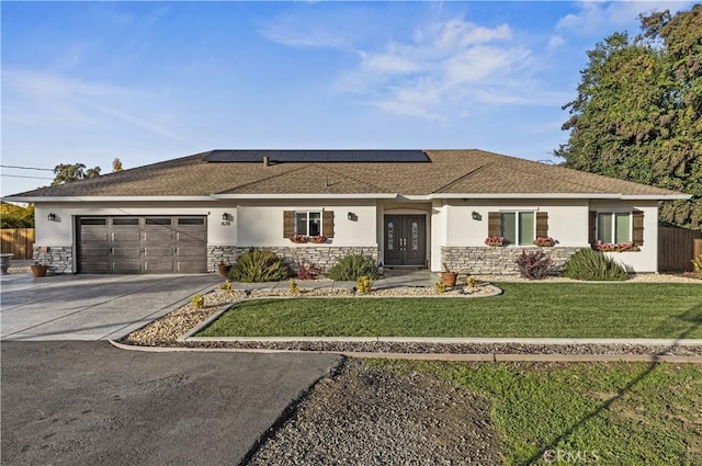 678 Colusa, Gridley, CA 95948 - ranch-style home featuring stone siding, stucco siding, concrete driveway, and an attached garage