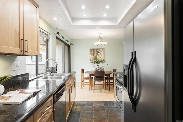 4535 Chateau Dr, San Diego, CA 92117 - kitchen with stainless steel appliances, a sink, recessed lighting, dark stone finish floors, and a chandelier