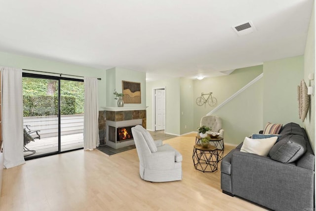 4535 Chateau Dr, San Diego, CA 92117 - living room with wood finished floors, a fireplace, and stairway