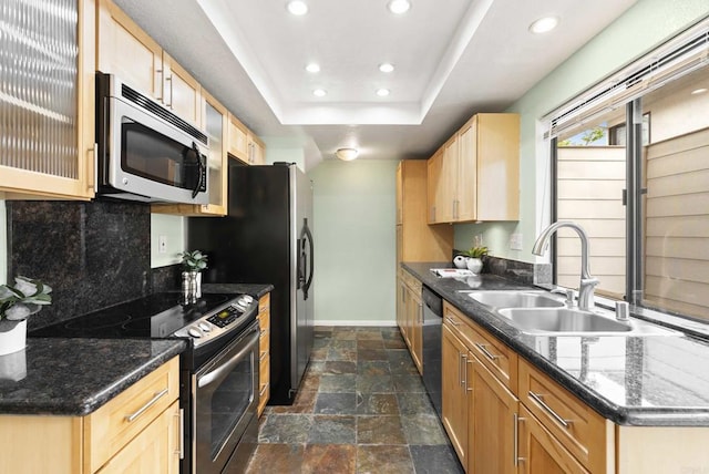 4535 Chateau Dr, San Diego, CA 92117 - kitchen featuring appliances with stainless steel finishes, backsplash, baseboards, a sink, and dark stone finish floors