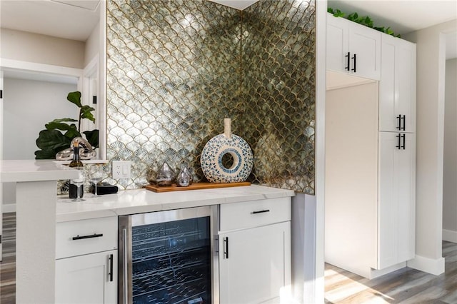 4930 W 142nd St, Hawthorne, CA 90250 - indoor dry bar featuring wine cooler, light wood-style floors, tasteful backsplash, and baseboards