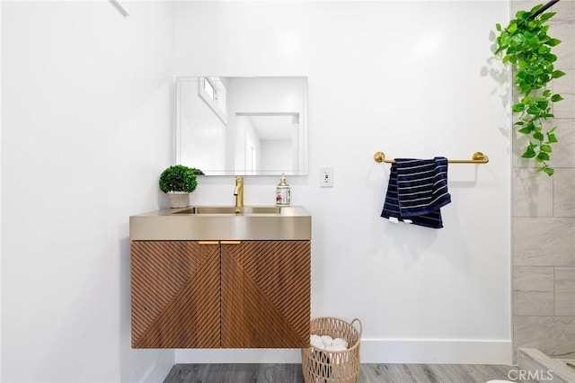 4930 W 142nd St, Hawthorne, CA 90250 - full bathroom featuring vanity, baseboards, and wood finished floors