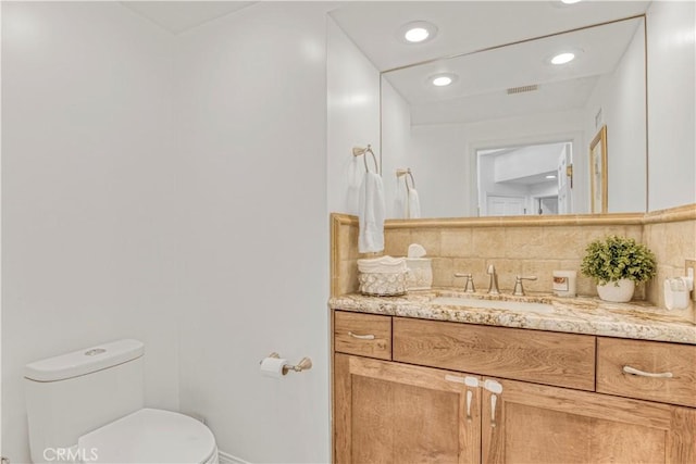 18238 Hastings Way, Porter Ranch, CA 91326 - half bathroom featuring vanity, backsplash, toilet, baseboards, and recessed lighting