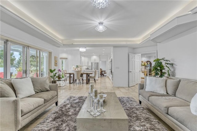 18238 Hastings Way, Porter Ranch, CA 91326 - living room with a raised ceiling, a chandelier, and light tile patterned floors