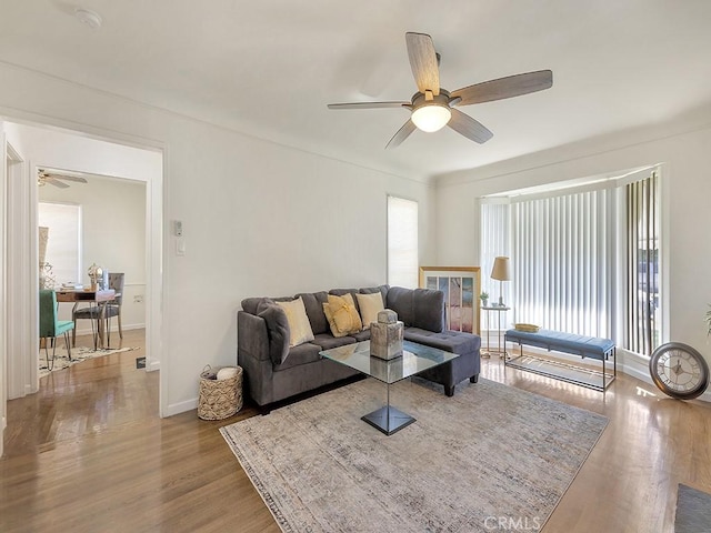 8830 Ruthelen St, Los Angeles, CA 90047 - living room with a ceiling fan, an office area, wood finished floors, and baseboards