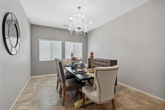42667 Gazapo Ct, Indio, CA 92203 - tiled dining area featuring a chandelier and baseboards