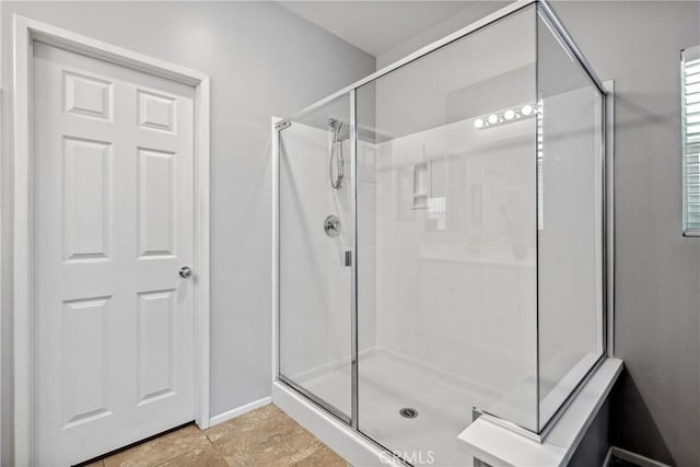42667 Gazapo Ct, Indio, CA 92203 - full bathroom with a stall shower and baseboards