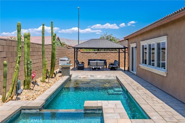 42667 Gazapo Ct, Indio, CA 92203 - view of swimming pool featuring a gazebo, an outdoor hangout area, a fenced backyard, a pool with connected hot tub, and a patio area
