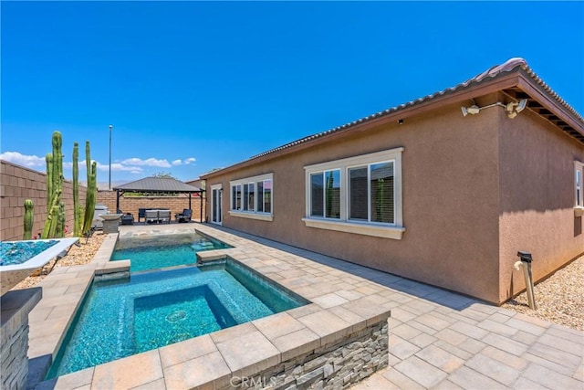 42667 Gazapo Ct, Indio, CA 92203 - view of pool with a gazebo, an in-ground hot tub, a patio area, and a fenced backyard