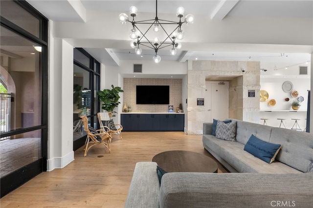 24585 Town Center Dr Unit 4308, Valencia, CA 91355 - living area featuring a chandelier, light wood-style flooring, and beam ceiling