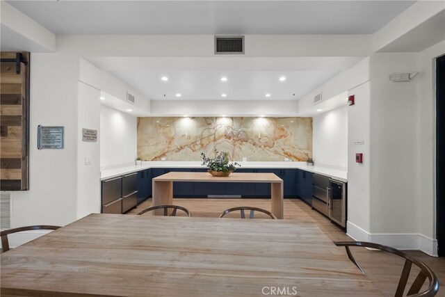 24585 Town Center Dr Unit 4308, Valencia, CA 91355 - kitchen featuring light countertops, decorative backsplash, recessed lighting, wine cooler, and modern cabinets
