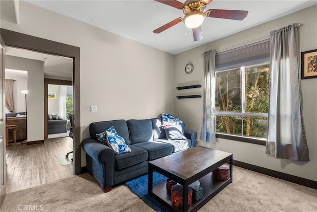 24585 Town Center Dr Unit 4308, Valencia, CA 91355 - carpeted living room with healthy amount of natural light, ceiling fan, and baseboards