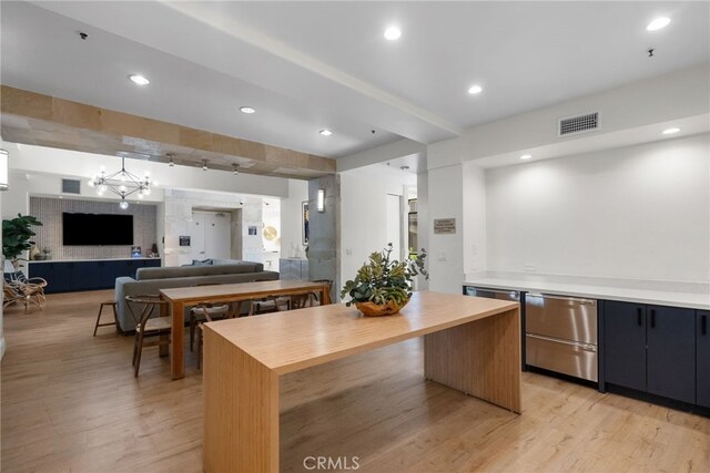 24585 Town Center Dr Unit 4308, Valencia, CA 91355 - kitchen with wooden counters, light wood-type flooring, open floor plan, a center island, and stainless steel dishwasher