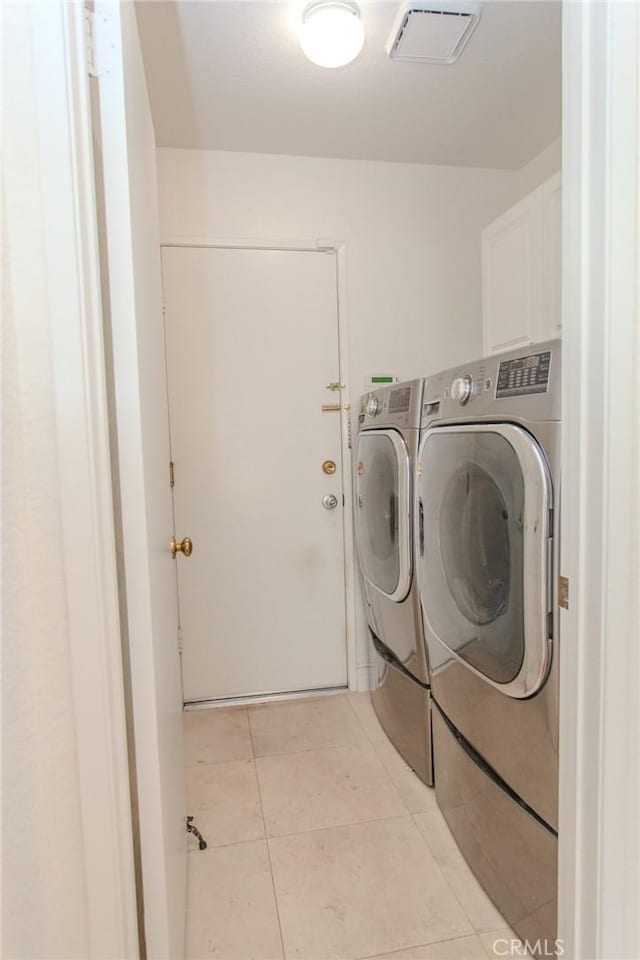 824 Leyland Dr, Diamond Bar, CA 91765 - laundry room featuring cabinet space, separate washer and dryer, and light tile patterned flooring
