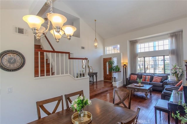 824 Leyland Dr, Diamond Bar, CA 91765 - dining area featuring high vaulted ceiling, wood-type flooring, a chandelier, and stairway