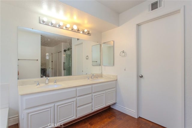 824 Leyland Dr, Diamond Bar, CA 91765 - full bathroom featuring a stall shower, double vanity, and wood finished floors