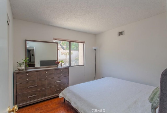 824 Leyland Dr, Diamond Bar, CA 91765 - bedroom featuring dark wood-type flooring and a textured ceiling