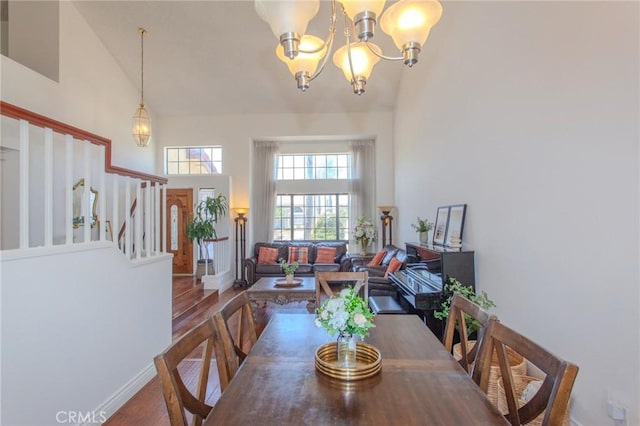 824 Leyland Dr, Diamond Bar, CA 91765 - dining area featuring high vaulted ceiling, wood finished floors, a chandelier, and stairway