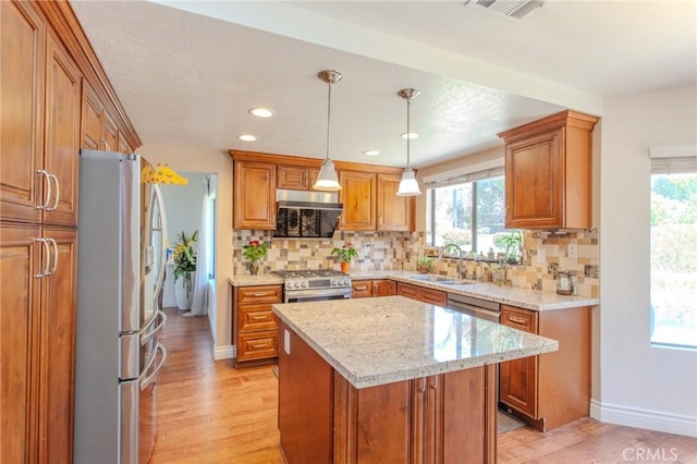 824 Leyland Dr, Diamond Bar, CA 91765 - kitchen with appliances with stainless steel finishes, light wood-style flooring, plenty of natural light, brown cabinets, and recessed lighting