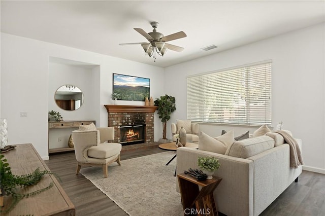 1665 Valley Falls Ave, Redlands, CA 92374 - living room with wood finished floors, a brick fireplace, ceiling fan, and baseboards