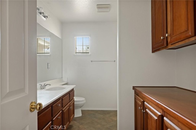 1665 Valley Falls Ave, Redlands, CA 92374 - bathroom featuring vanity, toilet, and baseboards
