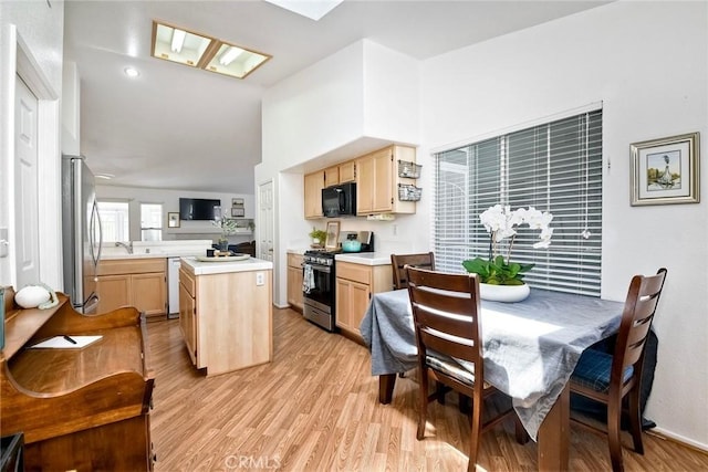 143 Brisas St, Oceanside, CA 92058 - dining room with light wood-style flooring and vaulted ceiling