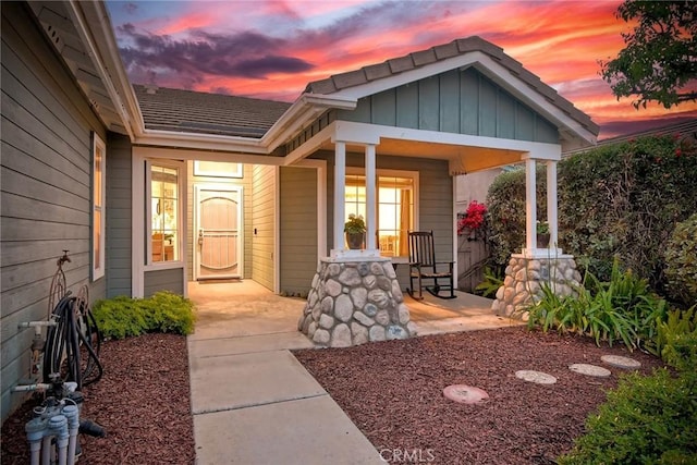 143 Brisas St, Oceanside, CA 92058 - exterior entry at dusk with a porch and board and batten siding