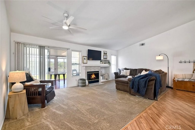143 Brisas St, Oceanside, CA 92058 - living area with ceiling fan, vaulted ceiling, a fireplace with flush hearth, and wood finished floors