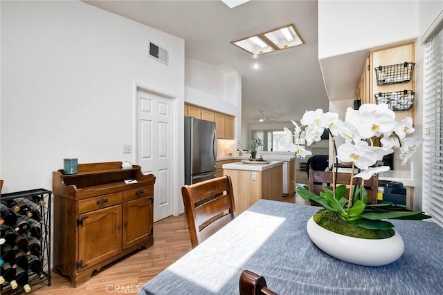 143 Brisas St, Oceanside, CA 92058 - dining room featuring light wood-style flooring and lofted ceiling