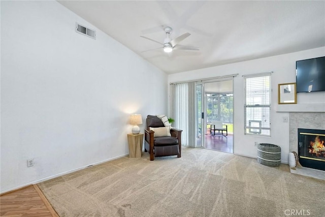 143 Brisas St, Oceanside, CA 92058 - living area featuring vaulted ceiling, ceiling fan, and a tiled fireplace
