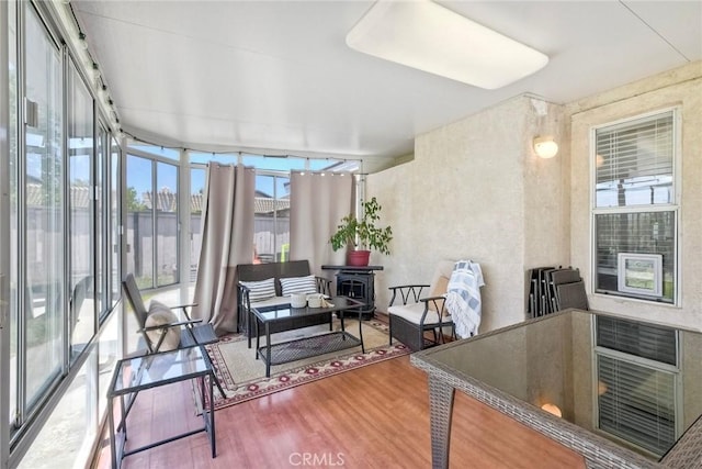 143 Brisas St, Oceanside, CA 92058 - sunroom featuring wood finished floors, an outdoor hangout area, and a wood stove
