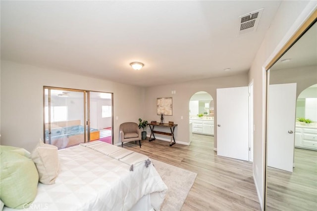 17470 Krameria Ave, Riverside, CA 92504 - bedroom featuring arched walkways and light wood finished floors