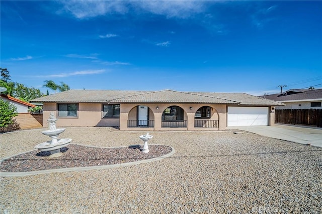 17470 Krameria Ave, Riverside, CA 92504 - view of front of home with covered porch, stucco siding, concrete driveway, a garage, and a tiled roof