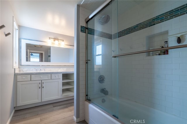 4357 W Sarah St Unit 26, Burbank, CA 91505 - bathroom with bath / shower combo with glass door, vanity, wood finished floors, and baseboards