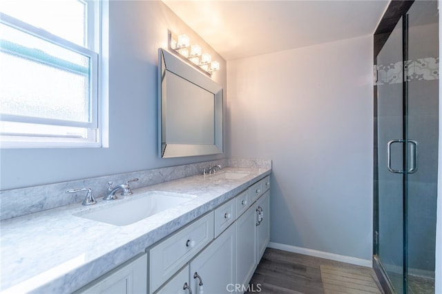 4357 W Sarah St Unit 26, Burbank, CA 91505 - full bath with plenty of natural light, double vanity, a shower stall, and wood finished floors