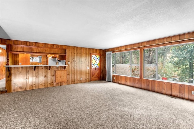 26972 State Highway 189, Blue Jay, CA 92317 - carpeted spare room featuring wooden walls