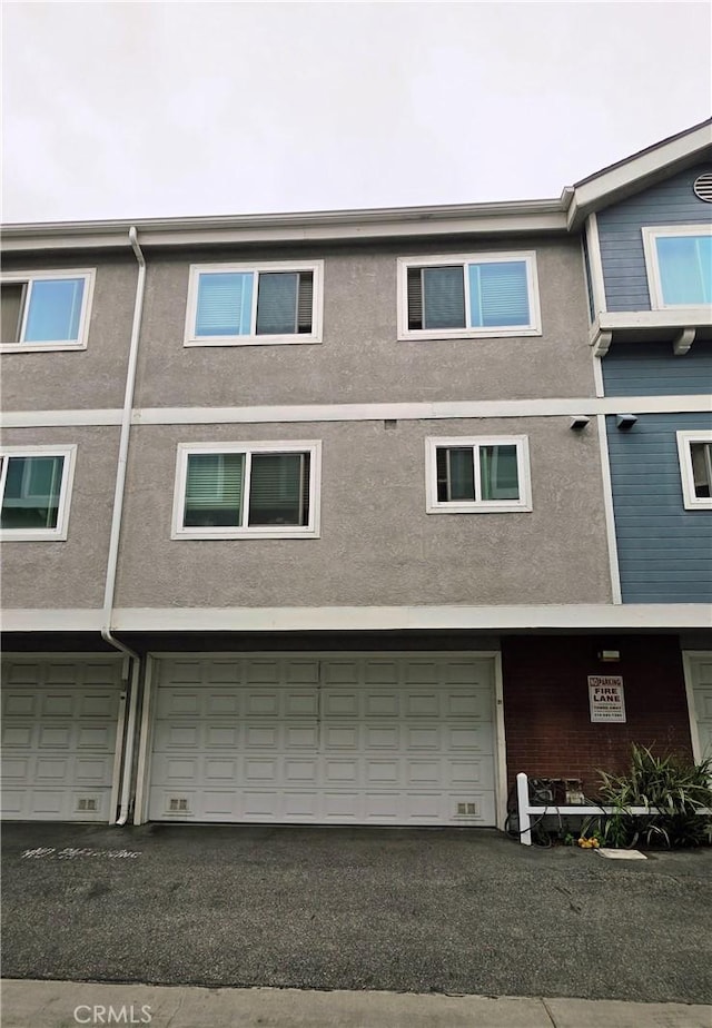 21901 Moneta Ave Unit 21, Carson, CA 90745 - back of house with stucco siding and a garage