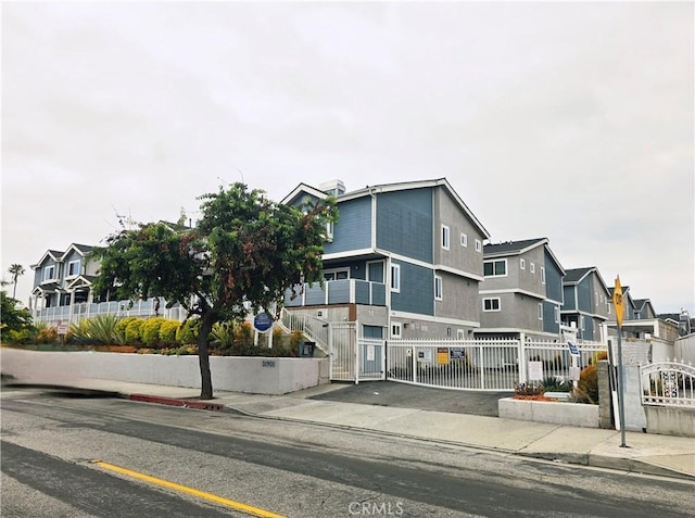 21901 Moneta Ave Unit 21, Carson, CA 90745 - view of building exterior with a residential view and a fenced front yard