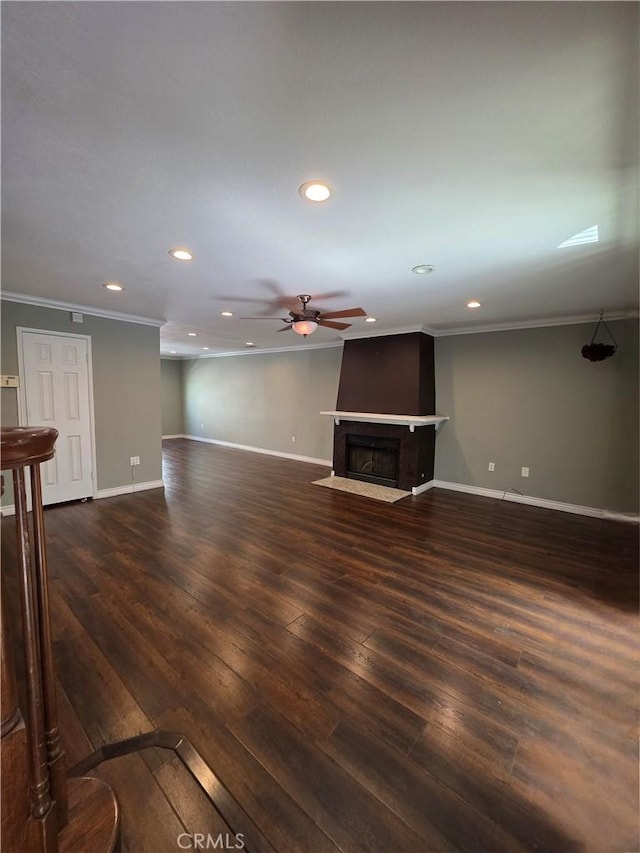 21901 Moneta Ave Unit 21, Carson, CA 90745 - unfurnished living room with ornamental molding, recessed lighting, ceiling fan, a fireplace with flush hearth, and wood finished floors